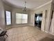 Tile floored dining area filled with sunlight and access to sliding glass doors at 681 Coronado Dr, Kissimmee, FL 34759