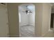 Flex room featuring modern gray laminate flooring and a ceiling fan at 681 Coronado Dr, Kissimmee, FL 34759