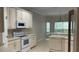 Neutral kitchen features a breakfast bar and dishwasher at 681 Coronado Dr, Kissimmee, FL 34759