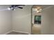 Arched entrance view of open floor plan, including laminate floor flex room, living room and patio at 681 Coronado Dr, Kissimmee, FL 34759