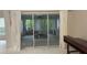 Screened in patio with three sliding glass doors at 681 Coronado Dr, Kissimmee, FL 34759