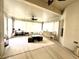 Spacious sunroom featuring tile floors, draped windows, and ceiling fan at 681 Coronado Dr, Kissimmee, FL 34759