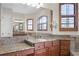 Bright bathroom boasting a granite vanity and large mirror at 729 San Raphael St, Kissimmee, FL 34759