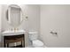Small bathroom with toilet, sink and vanity at 729 San Raphael St, Kissimmee, FL 34759