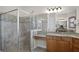 Bathroom with a walk-in shower and granite countertop at 729 San Raphael St, Kissimmee, FL 34759