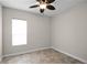 Bright bedroom with large window and ceiling fan at 729 San Raphael St, Kissimmee, FL 34759