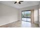 Bedroom with sliding glass doors and a view at 729 San Raphael St, Kissimmee, FL 34759
