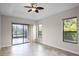 Bedroom with sliding doors leading to a patio at 729 San Raphael St, Kissimmee, FL 34759