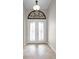 Elegant entryway with double doors and arched window detail at 729 San Raphael St, Kissimmee, FL 34759
