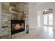 Stone fireplace with large hearth in the living room at 729 San Raphael St, Kissimmee, FL 34759