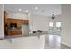 Kitchen with granite countertops, wood cabinets, and breakfast bar at 729 San Raphael St, Kissimmee, FL 34759
