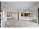 Open kitchen with island, granite countertops, and wood cabinets at 729 San Raphael St, Kissimmee, FL 34759