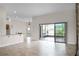 Open living area with tile floors and access to a patio at 729 San Raphael St, Kissimmee, FL 34759
