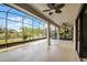 Expansive screened patio with a view of the surrounding nature at 729 San Raphael St, Kissimmee, FL 34759