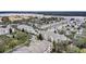An aerial view of colorful neighborhood with lush trees and sidewalks near lake at 3432 Westchester Square Blvd # 205, Orlando, FL 32835