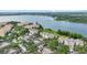 A beautiful aerial view of lakeside homes nestled among lush green trees at 3432 Westchester Square Blvd # 205, Orlando, FL 32835