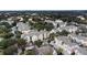 An aerial view of a neighborhood of colorful homes nestled among lush green trees at 3432 Westchester Square Blvd # 205, Orlando, FL 32835