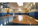 Indoor basketball court featuring hardwood floors, hoops, and wall padding at 3432 Westchester Square Blvd # 205, Orlando, FL 32835