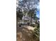 Picturesque community gazebo with decorative roof, surrounded by mature trees and lush landscaping at 3432 Westchester Square Blvd # 205, Orlando, FL 32835