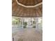 The interior of the gazebo has a wooden ceiling, brick flooring, and picnic table seating with views of the neighborhood at 3432 Westchester Square Blvd # 205, Orlando, FL 32835