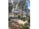 Charming community gazebo with decorative roof, offering a serene gathering spot surrounded by nature at 3432 Westchester Square Blvd # 205, Orlando, FL 32835