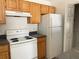This kitchen offers white appliances and ample cabinet space at 3432 Westchester Square Blvd # 205, Orlando, FL 32835