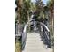 Community stairway surrounded by lush landscaping and palm trees at 3432 Westchester Square Blvd # 205, Orlando, FL 32835