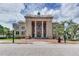 The Volusia County Court House with a brick walkway and large white columns at 531 Rhodes Dr, Deland, FL 32720