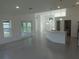 Open-concept living area with a modern kitchen island and plenty of natural light at 531 Rhodes Dr, Deland, FL 32720
