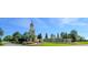 Grand Ridgewood Lakes entrance with a tower, floral displays, and the Del Webb logo at 333 Navarra Ln, Davenport, FL 33837