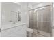 Modern bathroom with walk-in shower, vanity and quartz countertop at 2288 Sirena Ln, Mount Dora, FL 32757