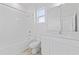 Clean bathroom featuring a shower-tub, modern vanity, and bright natural light at 2288 Sirena Ln, Mount Dora, FL 32757