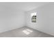 Cozy bedroom with large window, neutral carpet, and lots of natural light at 2288 Sirena Ln, Mount Dora, FL 32757