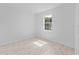Bright, airy bedroom with a large window and tile floors at 2288 Sirena Ln, Mount Dora, FL 32757