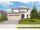 Charming two-story home featuring a landscaped front yard and a two-car garage at 2288 Sirena Ln, Mount Dora, FL 32757