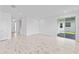 Spacious living room featuring tile floors, neutral paint, and sliding glass doors at 2288 Sirena Ln, Mount Dora, FL 32757