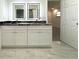 Chic bathroom vanity with dual sinks, granite countertops, and ample storage at 4808 Anderson Rd, Orlando, FL 32812