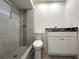 Modern bathroom featuring stylish tiled shower, sleek fixtures, and vanity with marble countertops at 4808 Anderson Rd, Orlando, FL 32812