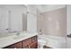 Well-lit bathroom features a shower over tub, stylish vanity, and neutral color palette at 6364 Lake Smith Cir, Windermere, FL 34786