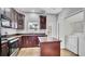 The kitchen boasts an island, tile flooring, plenty of cabinet space, and modern appliances at 6364 Lake Smith Cir, Windermere, FL 34786