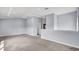 Bright and airy living room with neutral carpet and easy access to other rooms at 6364 Lake Smith Cir, Windermere, FL 34786