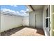 Private brick patio with white fence and easy access to backyard at 6364 Lake Smith Cir, Windermere, FL 34786