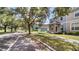 Charming two-story townhome with a red door and lovely front porch at 6364 Lake Smith Cir, Windermere, FL 34786