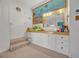 Unique bathroom boasts steps up to vanity with custom lighting, and coral themed mural at 9 Stone Gate N, Longwood, FL 32779
