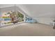 Tranquil bonus room with angular windows, scenic views, and suspended egg chair at 9 Stone Gate N, Longwood, FL 32779