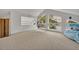 Bright bonus room with unique windows, scenic views, and a hanging swing chair at 9 Stone Gate N, Longwood, FL 32779