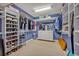 Spacious walk-in closet with custom shelving, providing ample storage for clothes and accessories at 9 Stone Gate N, Longwood, FL 32779