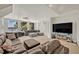 Bright and spacious living room offering scenic lake views and plush furniture arrangements at 9 Stone Gate N, Longwood, FL 32779