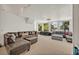 Expansive living room featuring scenic views, plush seating arrangements, and ample natural light at 9 Stone Gate N, Longwood, FL 32779