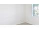 Bedroom showcasing a large window, neutral walls, and plenty of natural light at 3054 Suraj Cir, Tavares, FL 32778
